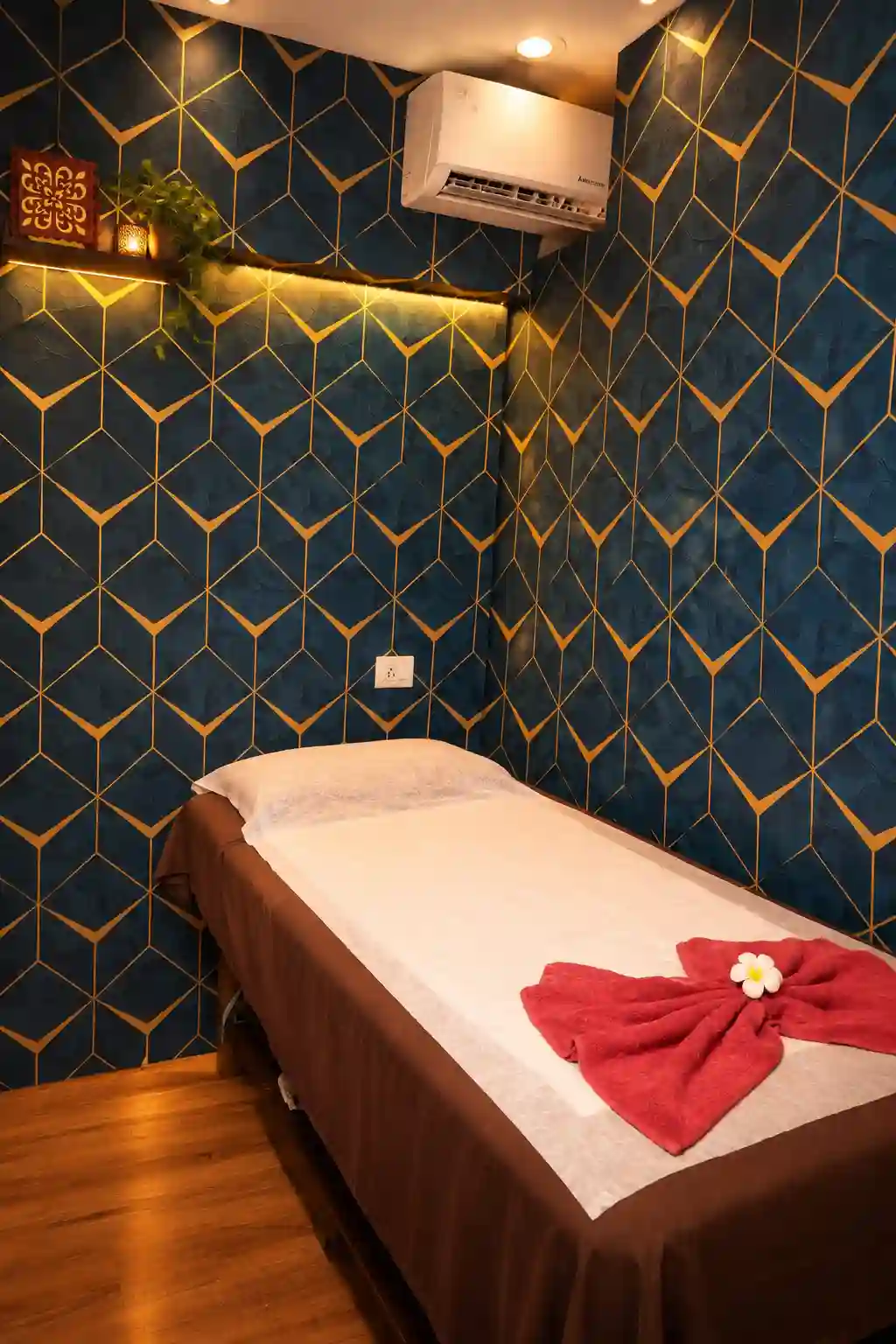 Massage table in a blue and gold private room